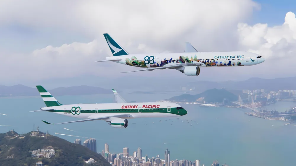 Cathay Pacific Boeing 777 and Airbus A350 aircraft in flight